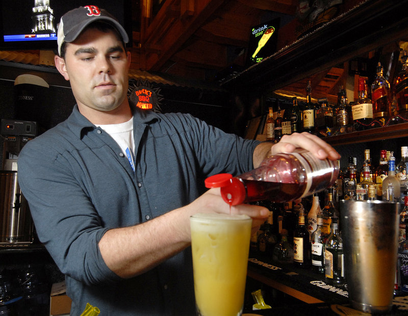 Bartender Nick Duffy mixes up a specialty drink at the new Buck’s Naked BBQ on Route 302 in North Windham, a second location for the popular Freeport restaurant.