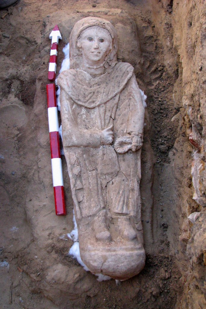 A carved plaster sarcophagus showing a woman dressed in a tunic was found at a desert oasis in Egypt. The burial style indicates the sarcophagus belonged to the period of Roman rule, from 31 B.C. until the Arab invasions of the 7th century.