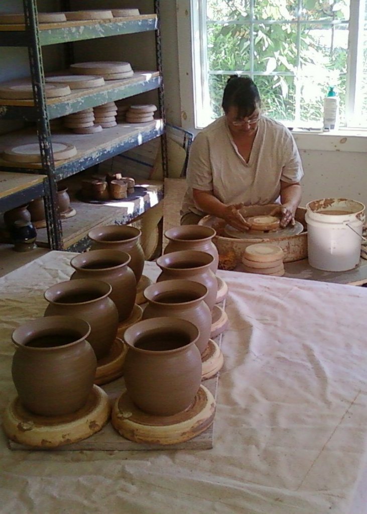 Beatrice Gilbert of North Yarmouth works on pots in her studio. She is one of 15 potters who sell wares at Maine Potters Market in Portland's Old Port.