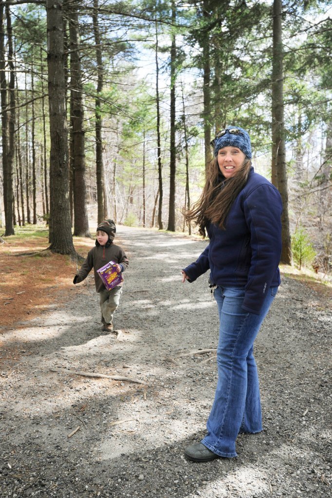 Rose Masse of Portland and her son, Jonathan Rand, are almost daily visitors to the walking trail on Mackworth Island. In response to the state's budget crisis, visitors to Mackworth will be paying a fee to visit – a move that Masse opposes.