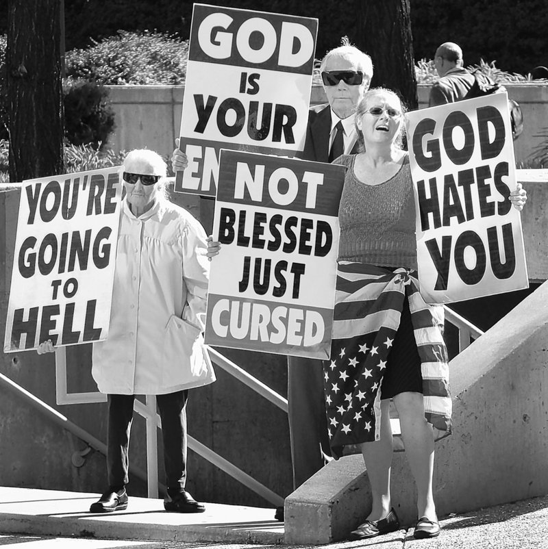 Westboro Baptist Church members Margie M. Phelps, left, with her husband, Pastor Fred Phelps, and her daughter Margie J. Phelps during a demonstration outside the federal courthouse in Baltimore, Md., in 2007 as a jury deliberated in a suit filed against them by the father of Matthew Snyder.