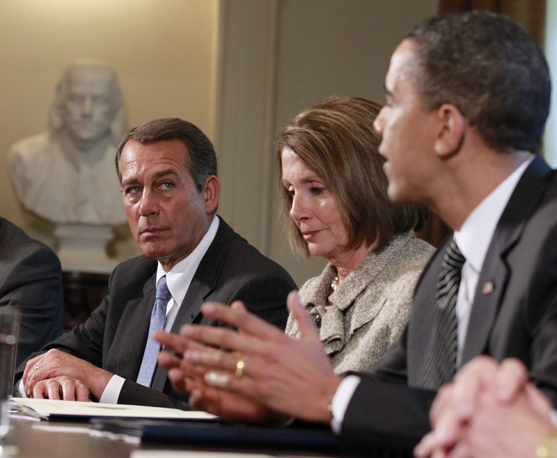 House Minority Leader John Boehner, R-Ohio, listens Wednesday at the White House as President Obama and congressional leaders discuss an overhaul of regulations that govern how Wall Street operates. Between them is House Speaker Nancy Pelosi, D-Calif.