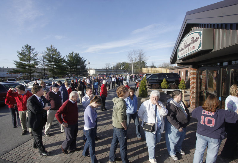 A line forms outside the Italian Heritage Center in Portland, where Gov. Baldacci hosted a spaghetti supper to benefit Preble Street on Wednesday. The event was a response to a move by the Catholic Church, which said it was withdrawing funding because of Preble Street’s support of a same-sex marriage ballot question.
