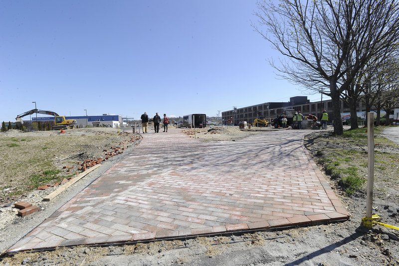A brick walkway at Preble Street marks an under-construction section of the trail.