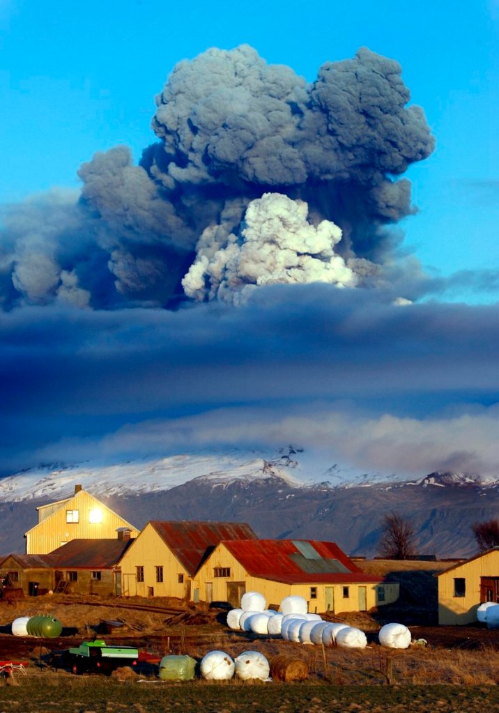 The volcano in Iceland’s Eyjafjallajokull glacier sends ash skyward just before sunset Friday. Unlike ash from organic sources, this ash is a combination of small, pulverized rock and glass that can damage planes.