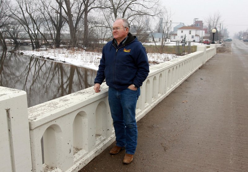Chelsea, Iowa, Mayor Roger Ochs looks over Otter Creek in Chelsea on March 9. Chelsea’s 297 residents were tempted to move after 2008’s flood but ultimately opted to stay put.