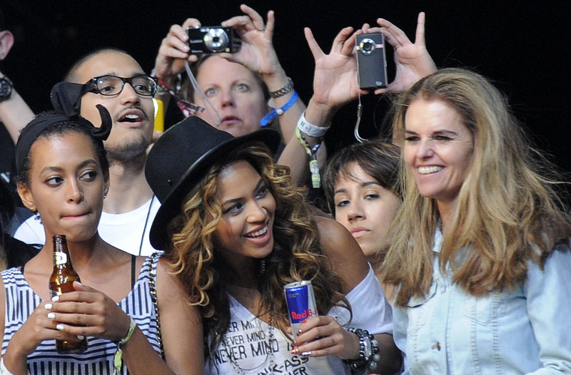 Beyonce Knowles, center, and her sister Solange, left, watch Jay Z perform with California’s first lady, Maria Shriver, right, during the Coachella Valley Music and Arts Festival in Indio, Calif. Some performers were no-shows as the Iceland volacano disrupted air travel.