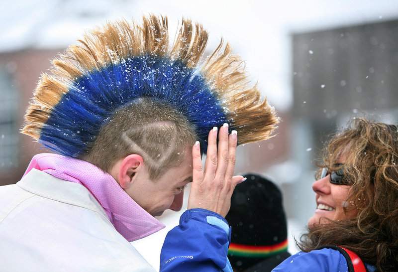 Mary Mason of Naples checks out the mohawk Chris Heal of Epping, N.H., has been growing for nine months to have it ready for the Bud Light Reggae Fest at Sugarloaf in Carrabassett Valley. Heal says that after the festival he'll shave it off and start growing it again for next year.
