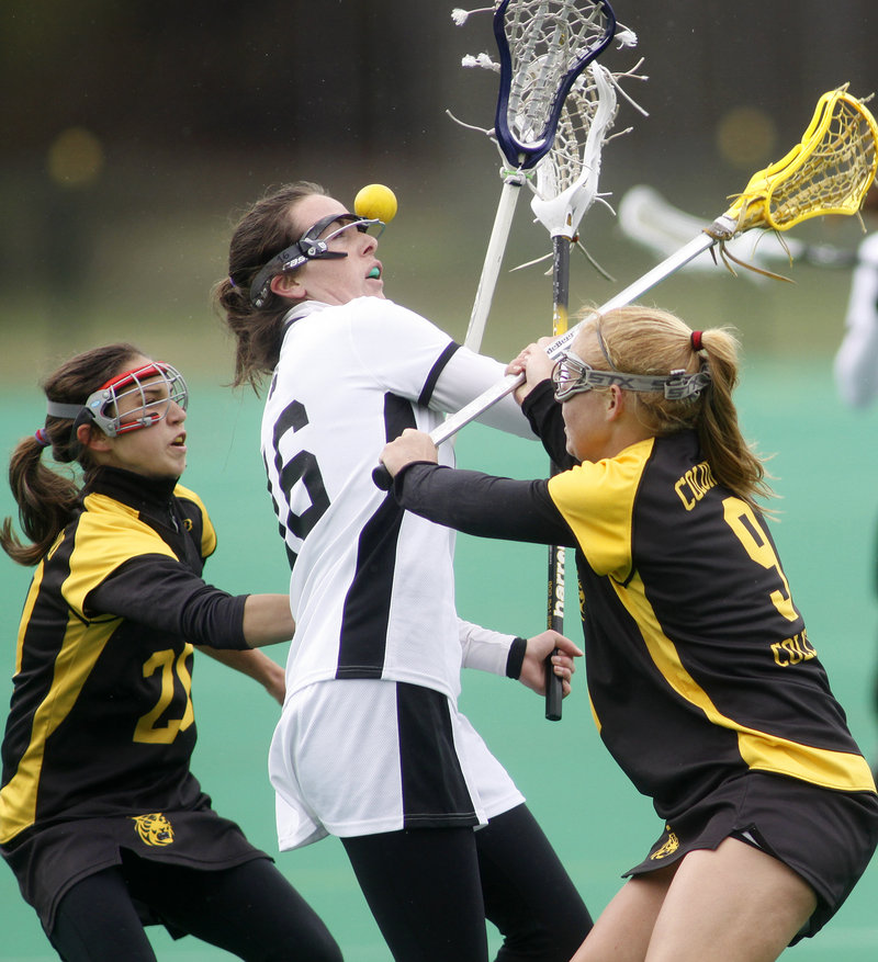 Helen Conaghan of Bowdoin, center, loses control of the ball while defended by Colorado College’s Gioia Garden, left, and Hollis Moore during Bowdoin’s 17-3 women’s lacrosse victory Saturday at Brunswick.
