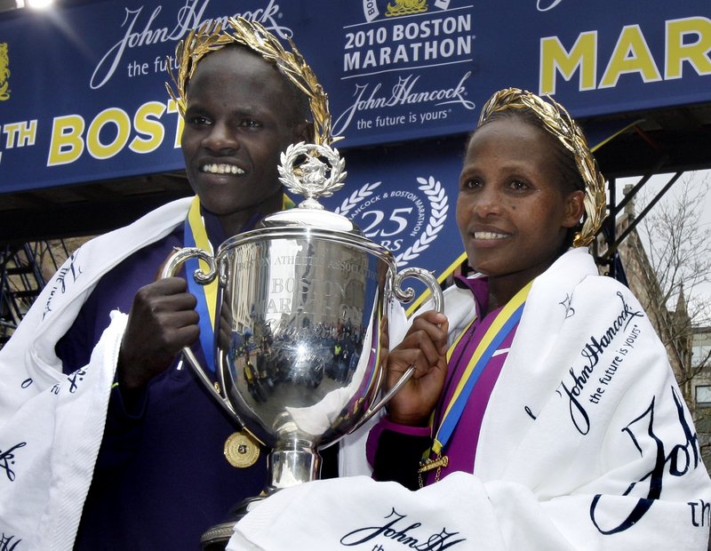 Boston Marathon men’s winner Robert Cheruiyot of Kenya and women’s winner Teyba Erkesso of Ethiopia celebrate Monday after the 114th running of the annual road race.