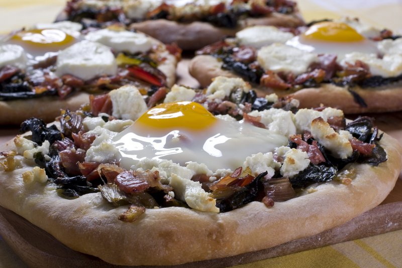 Egg on pizza can be delicious if the white cooks but the yolk remains runny, creating a sort of sauce.