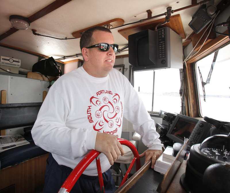 John Tracy, a senior captain for Casco Bay Lines, pilotsthe Island Romance into Portland after a run to Peaks Island on Wednesday. Tracy says there might not be enough room at the Maine State Pier for a larger boat.