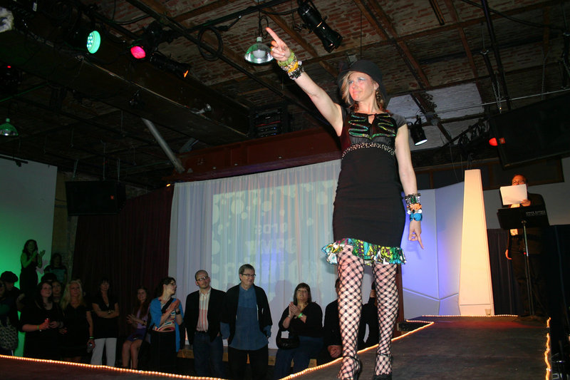 Designer Meredith Alex models her own Mad Girl World cocktail dress made of vintage fabric.