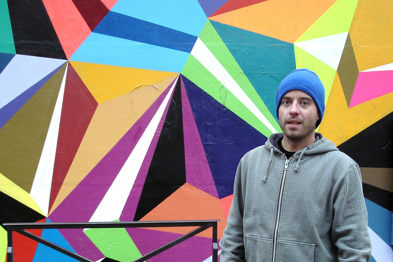 Matt Moore with one of his geometric, spray-painted designs at his “Crystals & Lasers” exhibition in Paris in February.