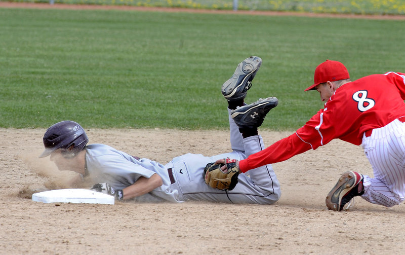 Steve Broy of Gorham slides safely into second with a stolen base Friday as Paul Reny of South Portland makes the late tag. It came during South Portland's 9-0 victory in a Telegram League opener at Wainwright Field in South Portland.