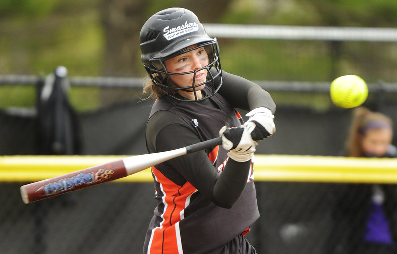 Heather Fecteau of Biddeford swings at a pitch from Deering's Kaylee Wheeler during her team's 5-0 win Friday in a softball season opener at Payson Park.