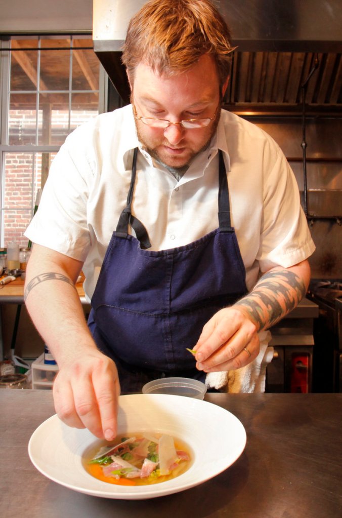 Chef/owner Erik Desjarlais puts the finishing touches on his Soupe de Printemps at Evangeline in Portland.