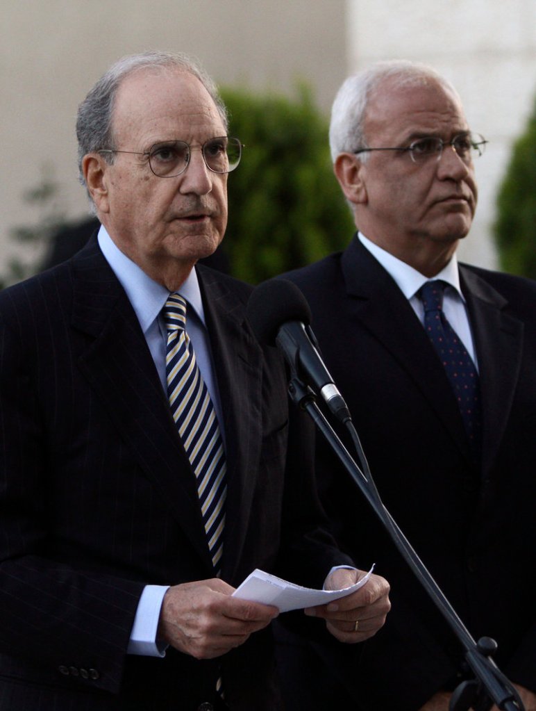 U.S. Mideast envoy George Mitchell, left, gives a statement to the press as Saeb Erekat, chief Palestinian negotiator, listens, in the West Bank city of Ramallah on Friday. Mitchell was to meet with the Israeli prime minister again today.