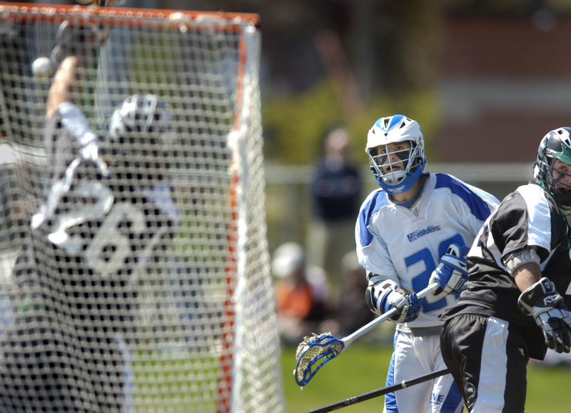 Dylan Thomas of the University of New England snaps a shot at Nichols goalie Scott Gray during a Commonwealth Coast Conference mens lacrosse game Saturday at Biddeford. Thomas had a goal and two assists in UNEs 11-1 victory.