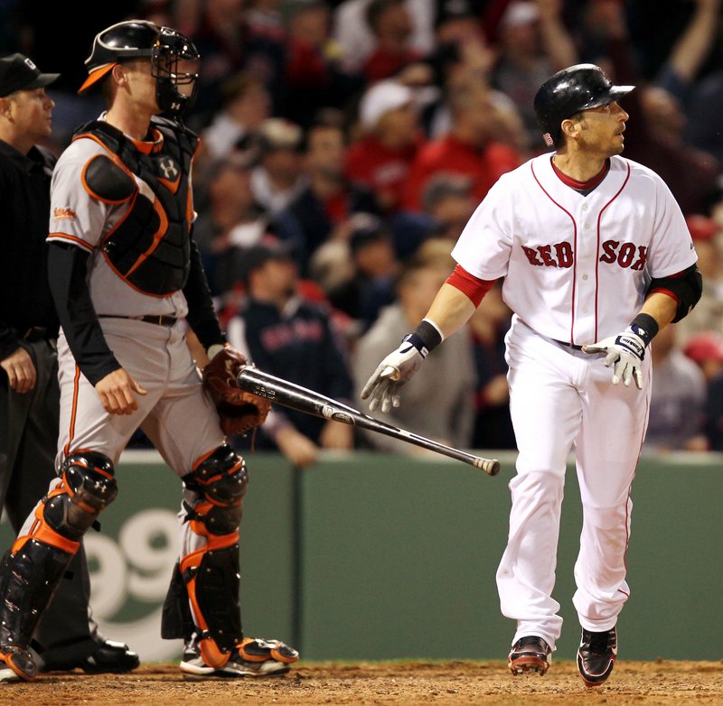Marco Scutaro of the Boston Red Sox and Baltimore catcher Matt Wieters watch Scutaro’s three-run homer in the seventh inning of a 7-6 victory Saturday night.