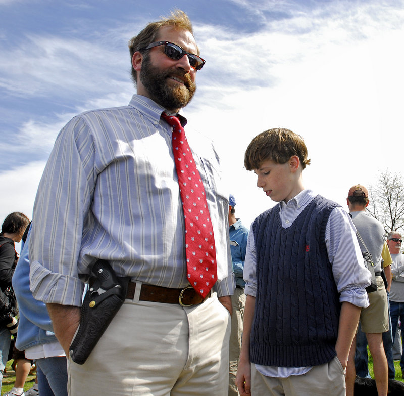 Charlie Carter of Bath attends the open-carry gathering with his son Felix, 11.