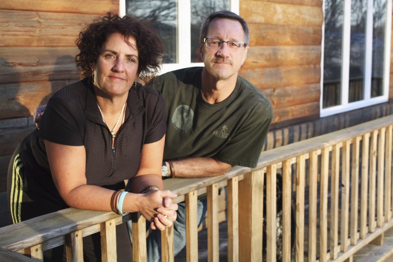 P.K. and Tom Harrison stand on the balcony of their home in Boon, Mich. The Harrisons have been on a campaign to prevent bullying since the suicide of their 16-year-old son Alex Harrison, who died in February 2009. A Michigan State Police investigation determined that Alex had been harassed by his peers at Cadillac High School before his death.