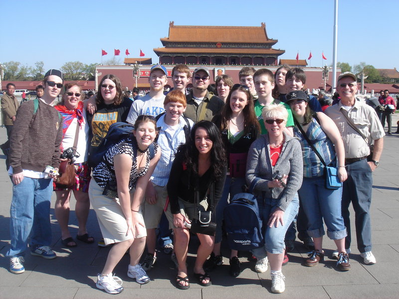 Brian Cushing, far right, poses with a group of Lake Region High School students during a 2007 trip to China. Here, the group visits Tiananmen Square in Beijing.