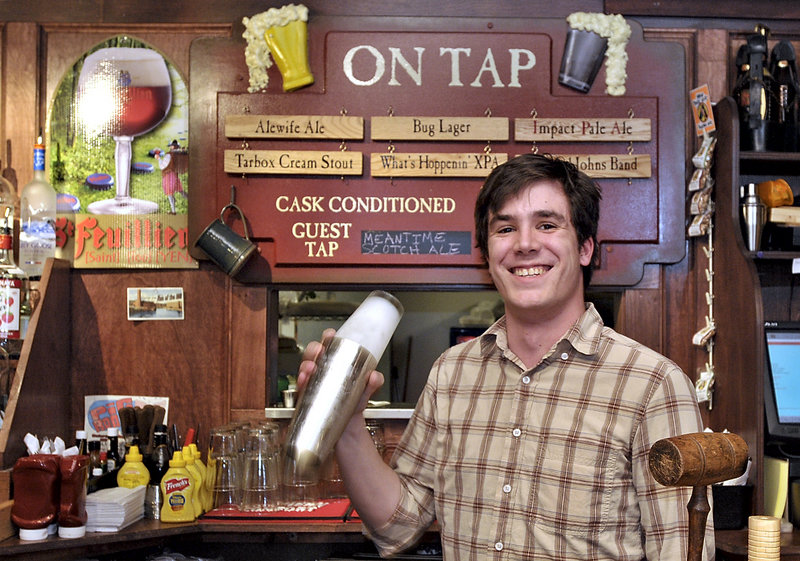 Bartender Chris Sweet gives a shake to a mixed drink at the Run of the Mill Public House & Brewery in Saco. The riverside brew pub produces a couple dozen beers on a yearly basis, and seven choices are always on tap.