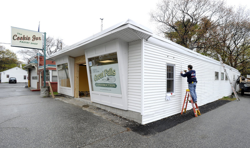 Eric Rosengren works on The Cookie Jar pastry shop on Shore Road in Cape Elizabeth. Renovations are nearly done and new equipment has been installed at the popular shop.
