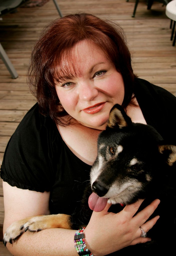 Karen Manderbachs holds her Shiba Inu, Kensey, at her home in Rocky Mount, N.C. Manderbachs is among the one in 10 pet owners in America who say they’d turn to their pets to talk out problems. Pets are good listeners, respondents explain – and they don’t clutter up the conversation with opinions.