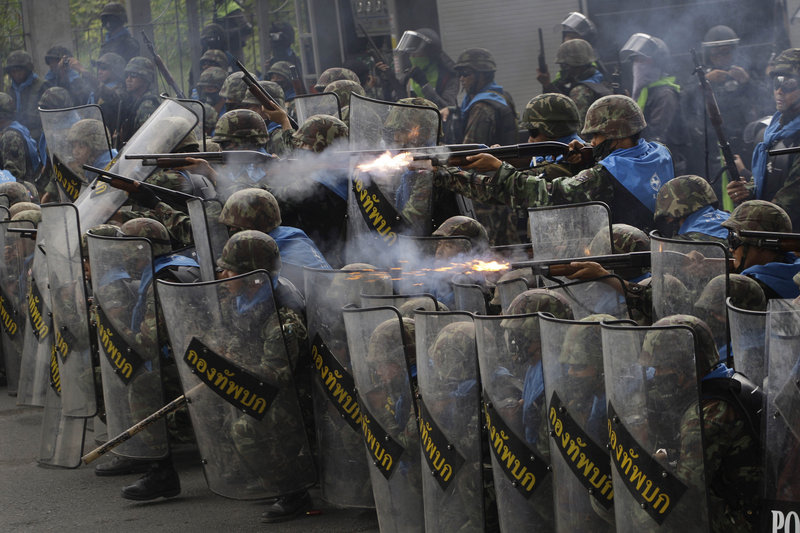 Thai soldiers fire on anti-government protesters during clashes near Bangkok, Thailand, on Wednesday as they tried to keep the Red Shirts from expanding their demonstrations from a base in the capital.