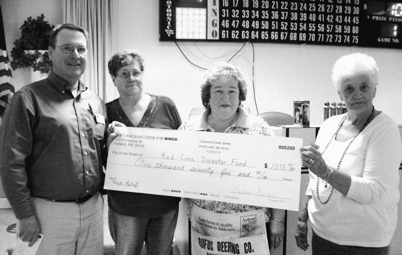 A $1,075 check to benefit Haiti is presented by Elks No. 188. From left are Dave Thompson of the Red Cross, and Joanne Gagnon, Diana Jenkins and Lorraine Cavallaro of Elks No. 188.
