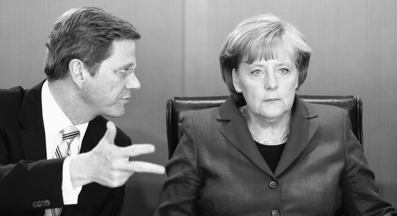 Germany’s Angela Merkel, right, is seen with Foreign Minister Guido Westerwelle at a meeting in Berlin on Wednesday.
