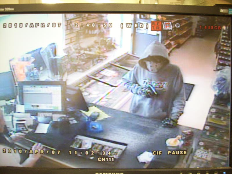 A security photo of a suspect in an armed robbery at Tabor's Variety Store on Ossippee Trail West in Standish yesterday, April 7. The suspect escaped on a bicycle.