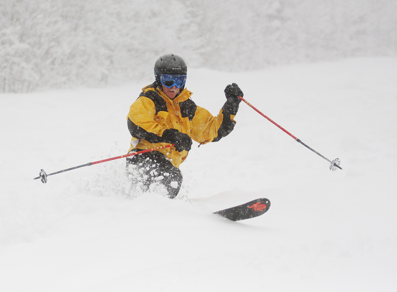 In photo taken today, a skier slaloms down one of 24 trails still open at Sugarloaf.
