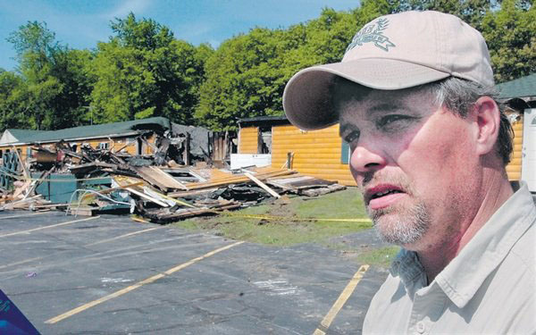Grandview Coffee Shop owner Donald Crabtree speaks outside his topless restaurant that was destroyed by fire early Wednesday June 3, 2009, morning.