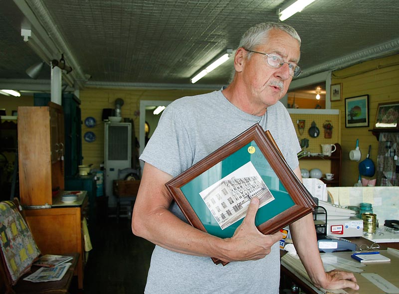 Don Engstrom of Dixmont, an employee at Traditions, an antique shop at the center of Corinna, reminisces about his employment at the Eastland Woolen Mill back in the 1970s.