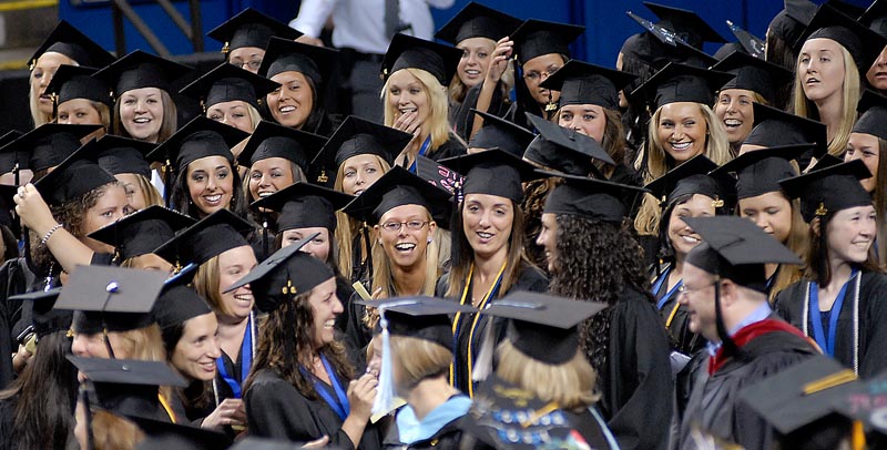 University of New England Graduates cheer as faculty members march into the Cumberland County Civic Center for Commencement today.