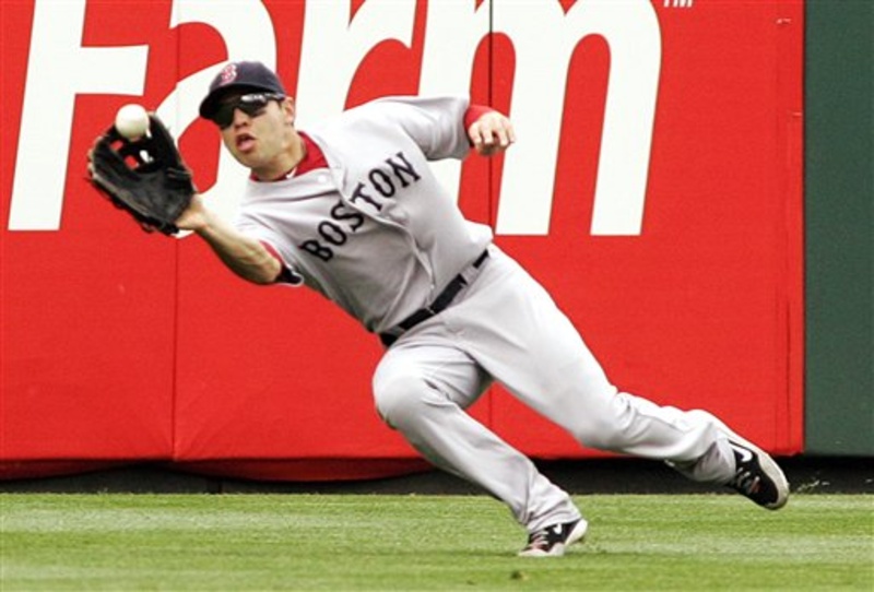 Red Sox left fielder Jacoby Ellsbury snags a hit by Philadelphia Phillies' Raul Ibanez during the seventh inning of Sunday's game in Philadelphia. The Red Sox won 8-3.