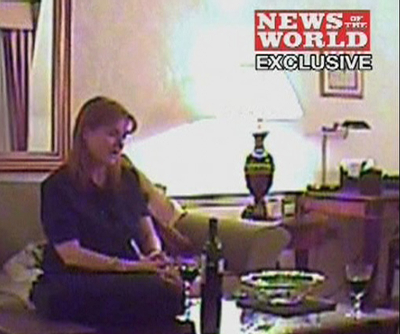 This image from video, made available by British newspaper News Of The World, purports to show Britain's Duchess of York Sarah Ferguson apparently offering to sell access to her ex-husband Prince Andrew in return for 500,000 pounds ($724,000), in London on an undisclosed date.