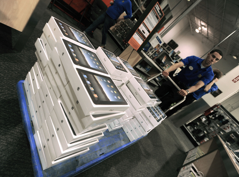 Best Buy employee Edwin Valadez brings Apple iPads out to be stocked on store shelves in Chicago. In the first quarter, consumers spent more on home furnishings and appliances, recreational goods and vehicles, clothing and entertainment.