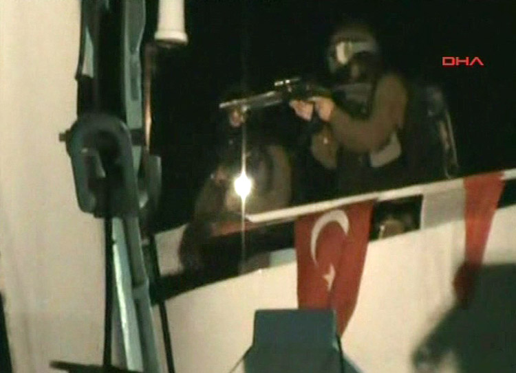 This video image released by the Turkish Aid group IHH today purports to show Israeli soldiers aiming a gun on the deck of a Turkish ship, part of an aid convoy heading to the Gaza Strip, after Israeli soldiers boarded the vessel in international waters. Israeli commandos on Monday stormed six ships carrying hundreds of pro-Palestinian activists on an aid mission to the blockaded Gaza Strip, killing at least 10 people and wounding dozens after encountering unexpected resistance as the forces boarded the vessels.