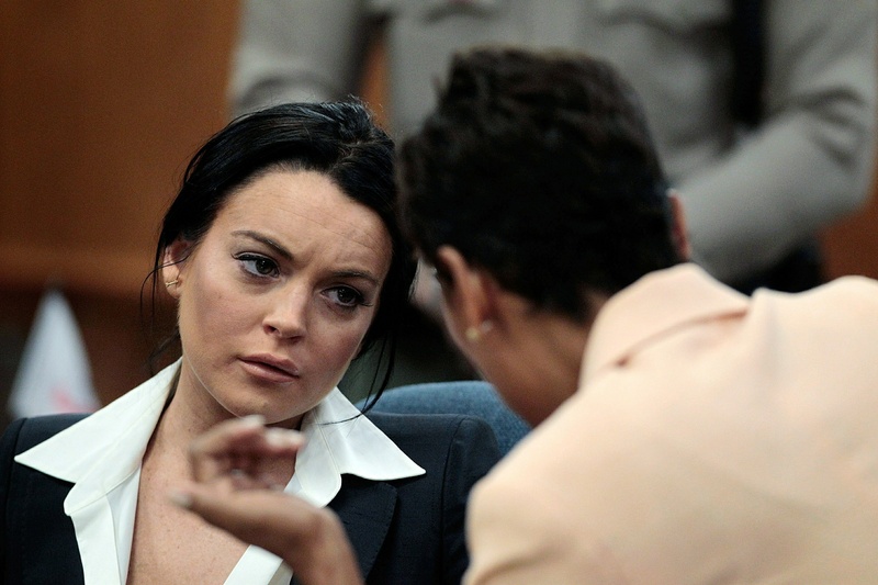 Actress Lindsay Lohan, left, talks to her attorney Shawn Chapman Holley during a hearing in Beverly Hills, Calif., on Monday. celebrities film Los Angeles County Los Angeles Superior Court movies topics topix bestof toppics toppix