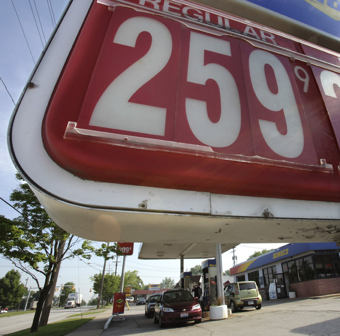 The price of a gallon of unleaded regular gasoline appears on the sign in front of a Sunoco gas station in Bedford, Ohio. Motorists will catch a break at the gas pump as they head out for the Memorial Day weekend.