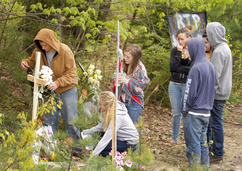 Scarborough High School students gather today at the site of a Saturday car crash on Payne Road in Scarborough that killed Stephen Delano, a senior at Scarborough High School.