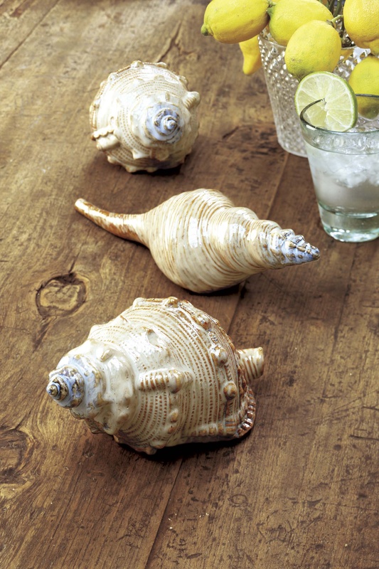 Adding a few nautical touches, such as these hand-painted and glazed ceramic conch shells from Pottery Barn can evoke a nice summery vibe in even the most landlocked home.