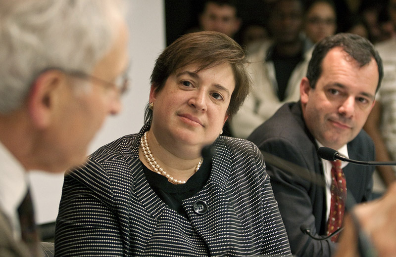 U.S. Solicitor General Elena Kagan, center, listens to law professor Charles Fried, left, alongside law professor John F. Manning, right, on the university campus in Cambridge, Mass, in this Sept. 11, 2009, photo released by the Harvard University Law School.