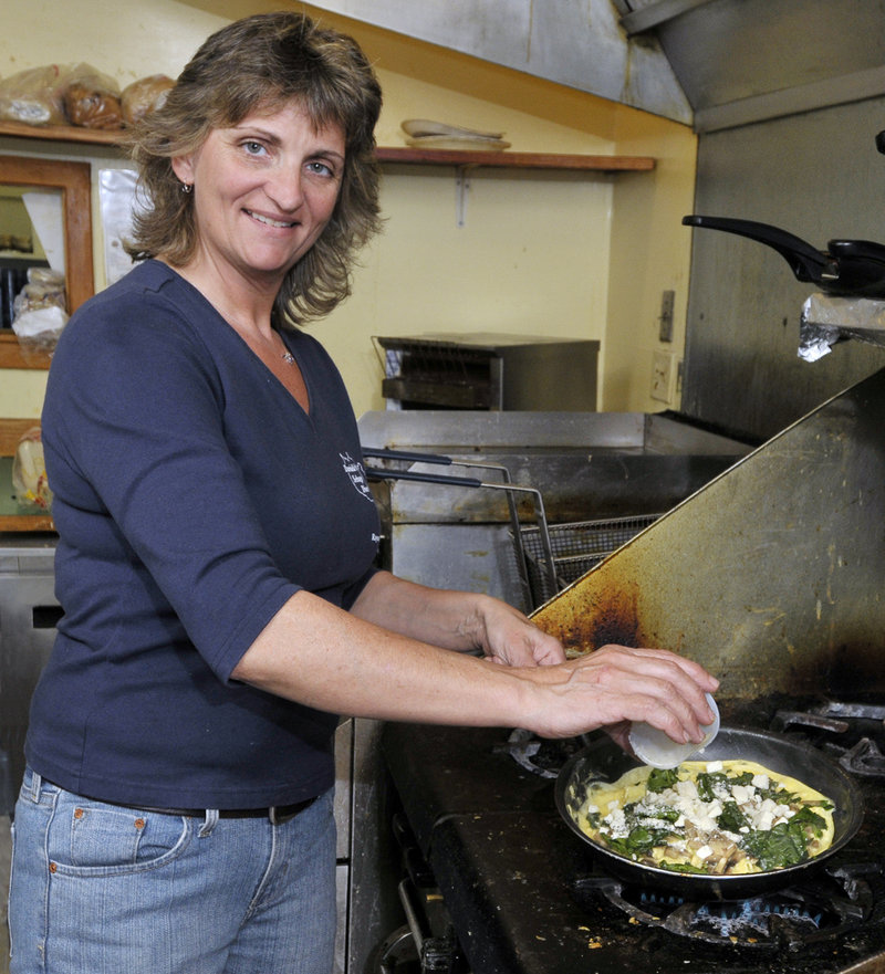 Danielle DeSimon, owner of Danielle’s Sebago Diner in Raymond, cooks up an impressive, hearty omelette with spinach, mushrooms and feta cheese.