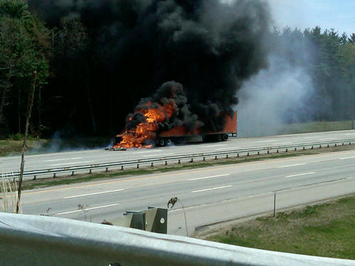 A tractor-trailer burns on the turnpike. “It’s just the worst timing – a Friday at 1:30 in the afternoon,” said state police Trooper Gavin Hager.