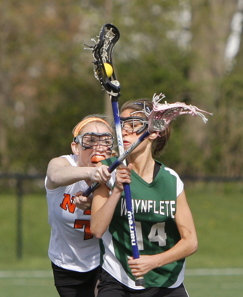 Hayley Bright of North Yarmouth Academy defends against Waynflete's Amy Allen during their lacrosse game Friday in Yarmouth. NYA won, 7-6.